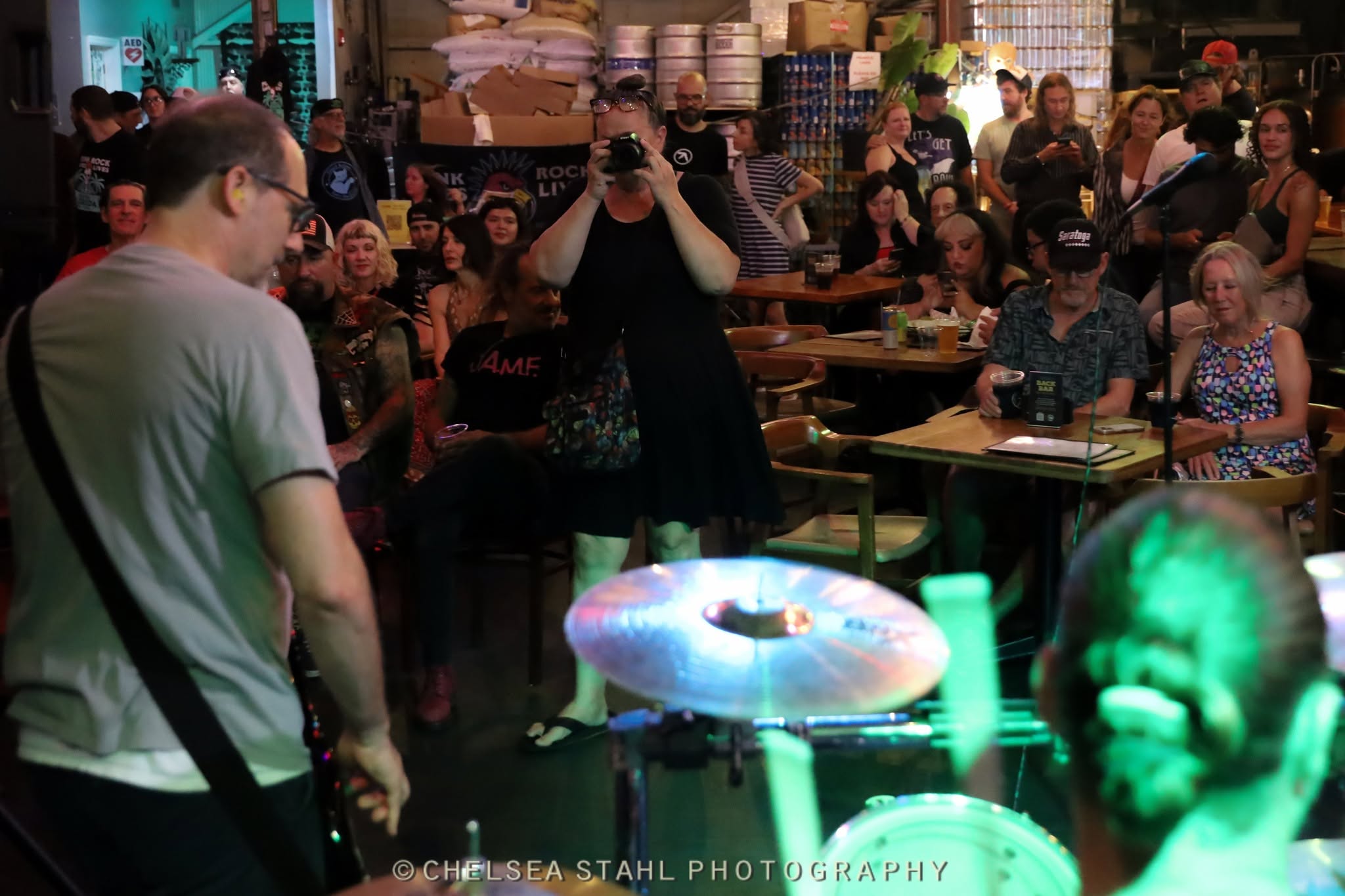 The PopSwap crowd seen from behind the Shakers drummer